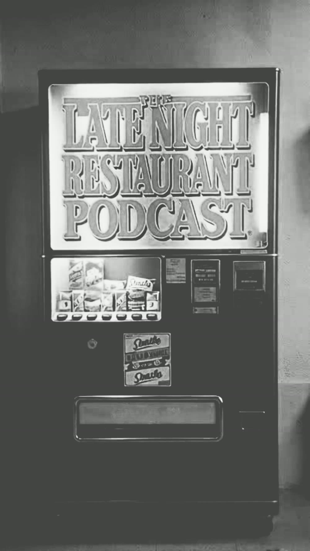 Vintage vending machine wrapped in The Late Night Restaurant Podcast logo