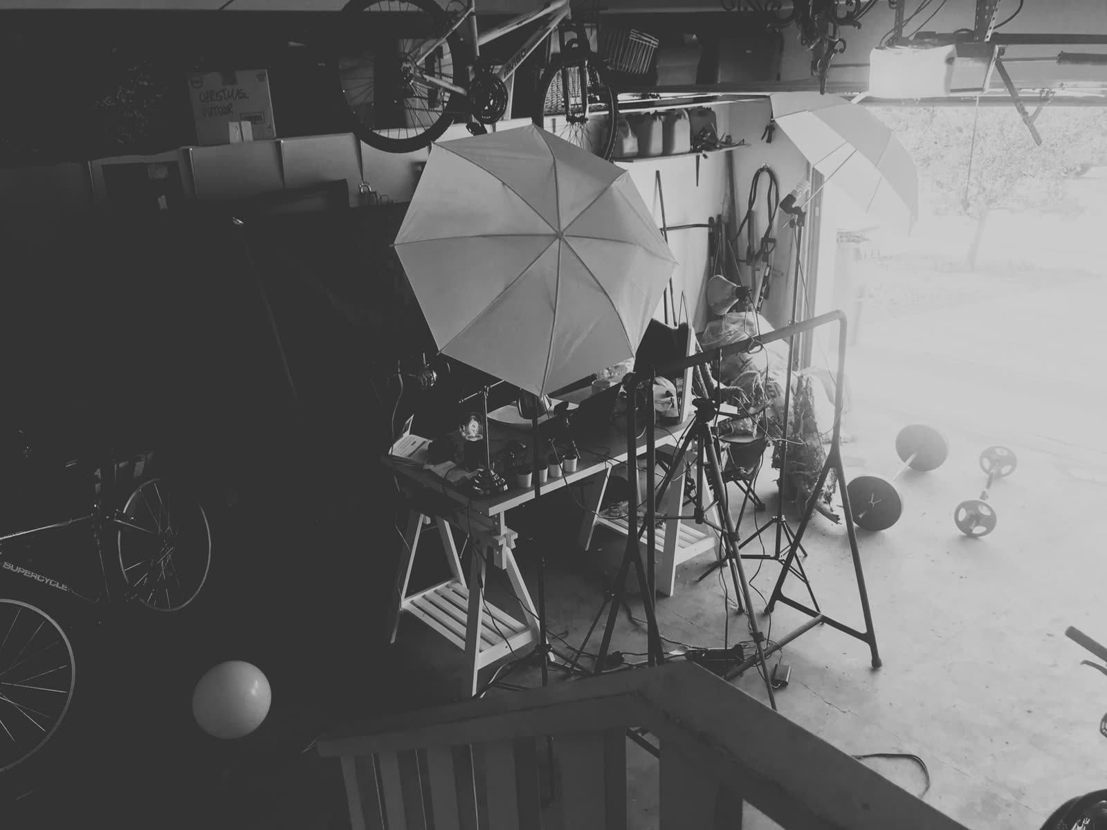 The original garage recording setup with umbrella lights and tripods